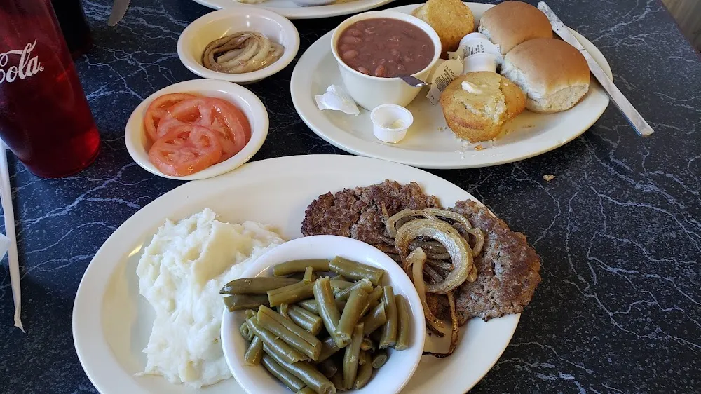 Hamburger Steak with Onions Green Beans Carrots Mashed Potatoes and Cornbread