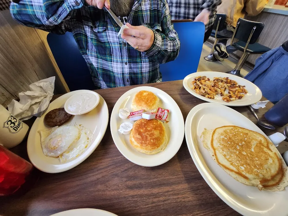 Over Med Eggs Sausage Patties Gravey Biscuits Homefries & Hot Cakes